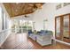 Inviting screened-in patio featuring comfortable seating and a stained wood ceiling with ceiling fans at 101 Goldenthal Ct, Cary, NC 27519