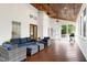 Inviting screened-in patio featuring comfortable seating and a stained wood ceiling with ceiling fans at 101 Goldenthal Ct, Cary, NC 27519