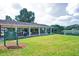 Community pavilion with picnic tables and a serene view of the pond at 101 Goldenthal Ct, Cary, NC 27519