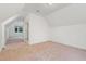 Spacious bedroom featuring neutral carpeting and natural light, leading to other rooms at 1021 Reaves Dr Dr, Chapel Hill, NC 27516