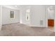 Bright, spacious bedroom featuring neutral carpeting and natural light from a large window at 1021 Reaves Dr Dr, Chapel Hill, NC 27516