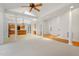 Open-concept living space with hardwood floors, skylights, and seamless flow to the kitchen at 1021 Reaves Dr Dr, Chapel Hill, NC 27516