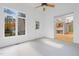 Bright sunroom leading to the kitchen, with exterior access and neutral carpet at 1021 Reaves Dr Dr, Chapel Hill, NC 27516