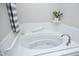 Comfortable, bright bathroom with a jetted soaking tub for relaxation at 1023 Kelton Cottage Way, Morrisville, NC 27560