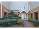 Well-maintained exterior with brick accents, mature landscaping, and welcoming entrance at 1023 Kelton Cottage Way, Morrisville, NC 27560