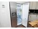 Stainless steel refrigerator with water dispenser in kitchen with black backsplash at 1023 Kelton Cottage Way, Morrisville, NC 27560