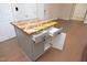 Kitchen island with a custom butcher block countertop, storage, and electrical outlets at 1023 Kelton Cottage Way, Morrisville, NC 27560