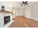 Spacious living room features a fireplace, hardwood floors, and an open floor plan at 1023 Kelton Cottage Way, Morrisville, NC 27560