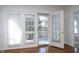 Bright sunroom with French doors leading to a balcony at 1023 Kelton Cottage Way, Morrisville, NC 27560