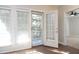 Sunroom with French doors leading to a balcony, offering natural light and inviting breezes at 1023 Kelton Cottage Way, Morrisville, NC 27560