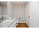 This bathroom features a granite vanity and modern fixtures at 1081 Wirewood Dr # 302, Raleigh, NC 27605