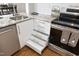 Kitchen featuring modern drawers and cabinets next to stainless steel appliances at 1081 Wirewood Dr # 302, Raleigh, NC 27605
