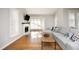 Cozy living room boasting a fireplace, hardwood floors, and many windows to let in natural light at 1081 Wirewood Dr # 302, Raleigh, NC 27605