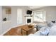 Cozy living room featuring a fireplace, hardwood floors and modern decor at 1081 Wirewood Dr # 302, Raleigh, NC 27605