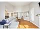 Bright living room featuring hardwood floors, fireplace, and an open floor plan to the kitchen at 1081 Wirewood Dr # 302, Raleigh, NC 27605