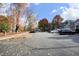 Parking lot with ample parking spaces and mature fall foliage at 1081 Wirewood Dr # 302, Raleigh, NC 27605