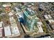 Aerial shot of modern high rise building with rooftop pool and surrounding cityscape on a sunny day at 110 N Corcoran St # 2502, Durham, NC 27701