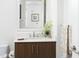 Beautiful bathroom vanity with sleek fixtures, contemporary decor, and patterned towels at 110 N Corcoran St # 2502, Durham, NC 27701