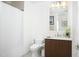 Bathroom featuring modern vanity with white countertop and dark wood cabinets at 110 N Corcoran St # 2502, Durham, NC 27701