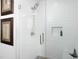 Bathroom features a walk-in shower with white subway tile and recessed niche at 110 N Corcoran St # 2502, Durham, NC 27701