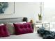 Bedroom featuring decorative pillows and mirrored nightstand at 110 N Corcoran St # 2502, Durham, NC 27701