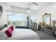 Bedroom featuring a sitting area, dresser with mirror, and floor-to-ceiling windows at 110 N Corcoran St # 2502, Durham, NC 27701
