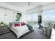 Spacious main bedroom featuring a large window with scenic views, mirrored closet and stylish decor at 110 N Corcoran St # 2502, Durham, NC 27701