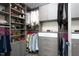 Organized closet with ample shelving and hanging space for shoes, clothes, and accessories at 110 N Corcoran St # 2502, Durham, NC 27701