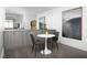 Cozy dining area with modern furniture, art pieces and unique banana decoration at 110 N Corcoran St # 2502, Durham, NC 27701