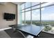 Bright game room with ping pong table and large windows offering panoramic views at 110 N Corcoran St # 2502, Durham, NC 27701