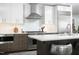 Modern kitchen with stainless steel appliances, island seating and white subway tile at 110 N Corcoran St # 2502, Durham, NC 27701
