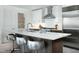 Contemporary kitchen featuring a large center island with seating and stainless steel appliances at 110 N Corcoran St # 2502, Durham, NC 27701