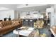 Bright living room with open floorplan features a modern kitchen and stylish decor at 110 N Corcoran St # 2502, Durham, NC 27701
