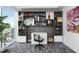 Stylish office with custom shelving and a built-in desk, perfect for a productive workspace at 110 N Corcoran St # 2502, Durham, NC 27701