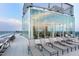 Rooftop lounge area with views, lounge chairs, glass enclosure and scenic views at 110 N Corcoran St # 2502, Durham, NC 27701