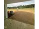 Image showcasing the expansive backyard with fresh dirt covering, perfect for customization and outdoor activities at 1101 Brookrun Dr, Oxford, NC 27565