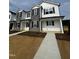 Two-story townhouse with stone accents and black shutters at 1101 Brookrun Dr, Oxford, NC 27565