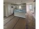 Bright kitchen with an island, white cabinets, and stainless steel appliances at 1101 Brookrun Dr, Oxford, NC 27565