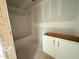 Unfinished bathroom featuring a tub and shower, and a white vanity cabinet at 1101 Brookrun Dr, Oxford, NC 27565