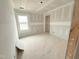 Empty bedroom with bright window; a blank canvas awaiting your personal style at 1101 Brookrun Dr, Oxford, NC 27565