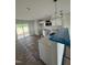 Modern kitchen with white cabinets, stainless steel microwave, and a view to the yard through sliding glass doors at 1102 Brookrun Dr, Oxford, NC 27565
