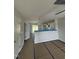 Bright living room with a ceiling fan that connects to the kitchen area, providing an open concept feel at 1102 Brookrun Dr, Oxford, NC 27565