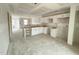 Bright new kitchen with unfinished details, white cabinets, and plenty of space for customization at 1102 Brookrun Dr, Oxford, NC 27565