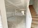 Spacious living room shows potential for living and dining areas, complemented by a staircase at 1102 Brookrun Dr, Oxford, NC 27565