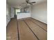 Spacious open-concept living area with neutral walls and a ceiling fan at 1103 Brookrun Dr, Oxford, NC 27565
