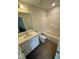 Bright bathroom with modern fixtures, tub and shower combination and white cabinets at 1104 Brookrun Dr, Oxford, NC 27565