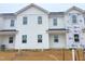 New construction townhome featuring modern white siding, clean lines, and an appealing contemporary design at 1104 Brookrun Dr, Oxford, NC 27565