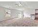 Bright living room features new carpet, large windows, and vaulted ceilings at 12 Crow Field St, Roxboro, NC 27574