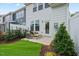 Cozy backyard sitting area with a small lawn and landscaping at 1259 Hammond Dr, Mebane, NC 27302