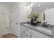 Bathroom with double vanity, modern fixtures, and elegant mirror at 1259 Hammond Dr, Mebane, NC 27302